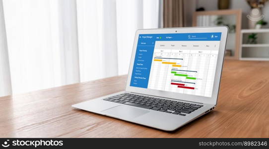 Project planning software for modish business project management on the computer screen showing timeline chart of the team project. Project planning software for modish business project management