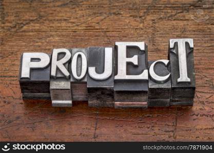 project word in mixed vintage metal type printing blocks over grunge wood