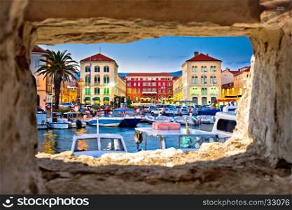 Prokurative square in Split evening view through stone window, Dalmatia, Croatia