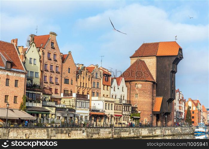 Promenade in Gdansk by the Motlawa river, view on Zuraw Port Crane.. Promenade in Gdansk by the Motlawa river, view on Zuraw Port Crane