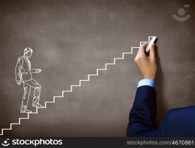 Promotion concept. Close up of human hand drawing career ladder with chalk