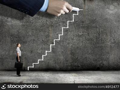 Promotion in career. Businesswoman stepping ladder drawn by hand with chalk
