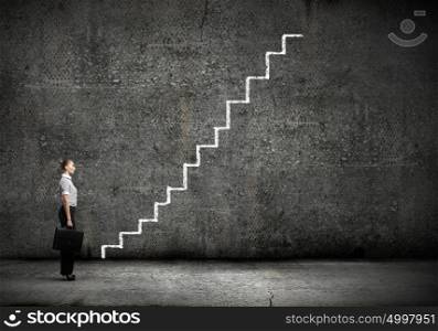 Promotion in career. Businesswoman stepping ladder drawn by hand with chalk