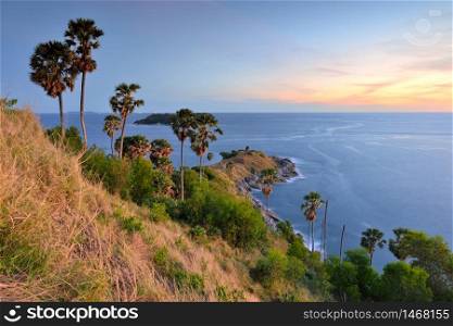 Promthep Cape is a mountain of rock that extends into the sea view point sunset in Phuket, Thailand