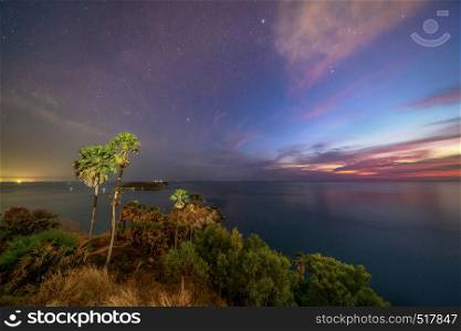 Promthep Cape viewpoint at sunset with Andaman sea and stars in Phuket Island, tourist attraction in Thailand. Natural landscape wallpaper background.