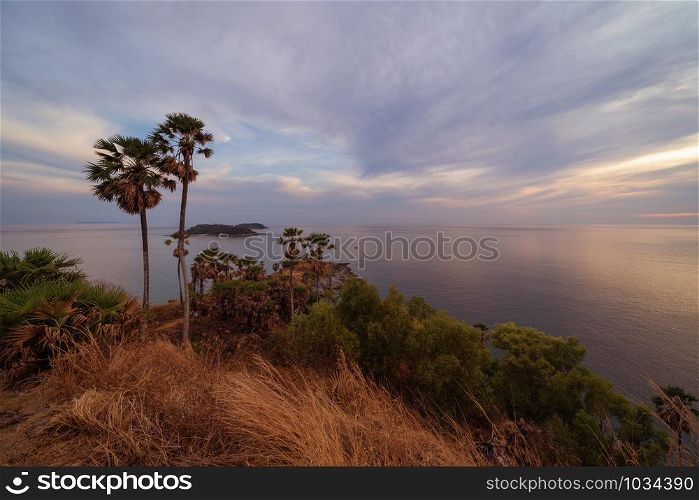 Promthep Cape viewpoint at sunset with Andaman sea in Phuket Island, tourist attraction in Thailand in travel trip and holidays vacation. Natural landscape wallpaper background.