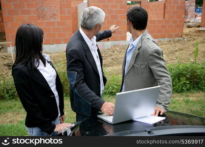 property developer with young couple