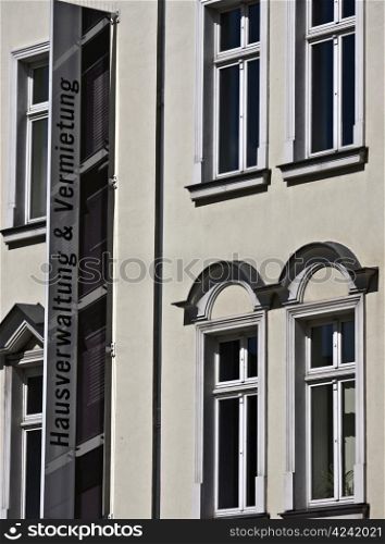 property management. Sign on a facade in Berlin for property management and renta
