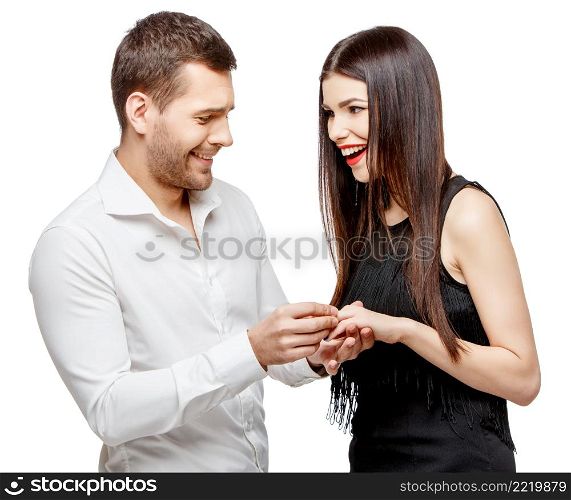 Proposal of marriage: young caucasian couple isolated on white. Proposal of marriage