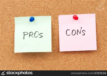 Pros and cons written on paper and pinned on corkboard