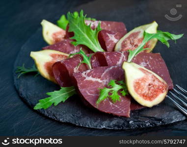 Prosciutto crudo with arugula and figs