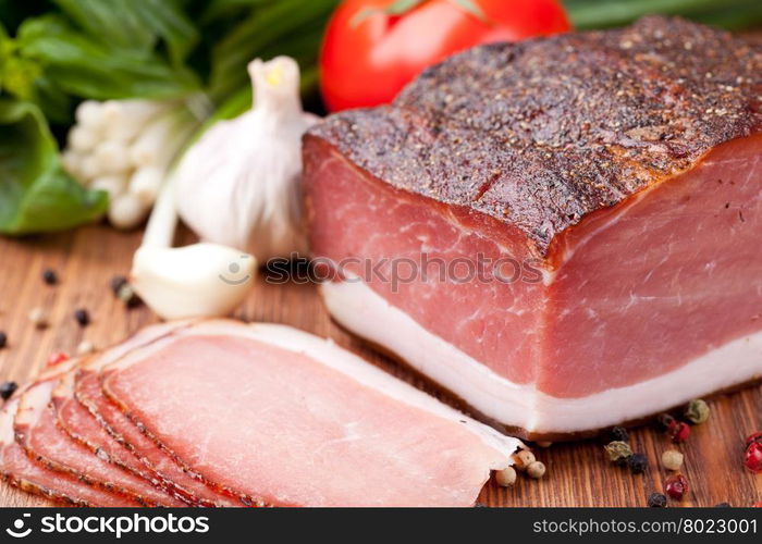 prosciutto. Italian prosciutto on a wooden table