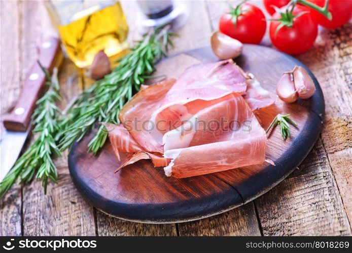 prosciutto on board and on a table