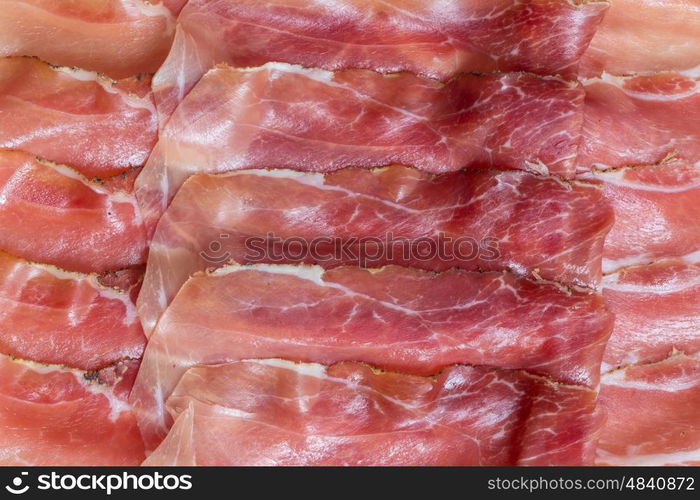 Prosciutto top view as background structure. Prosciutto top view as background structure.