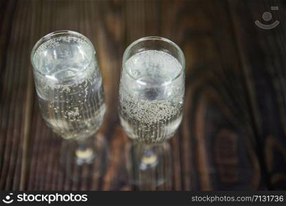 prosecco glass holiday drinks like themed party and holiday celebration concept with Champagne glasses for winter holidays decorated christmas on wooden table background