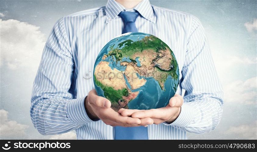 Protect life. Hands of businessman holding earth planet. Elements of this image are furnished by NASA