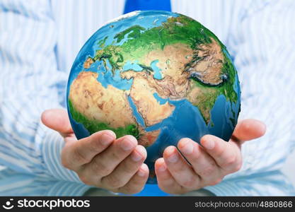 Protect life on Earth planet. Businessman hands holding Earth planet. Elements of this image are furnished by NASA