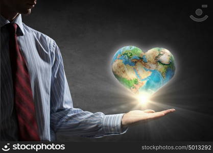 Protect life on Earth planet. Businessman hands holding Earth planet. Elements of this image are furnished by NASA