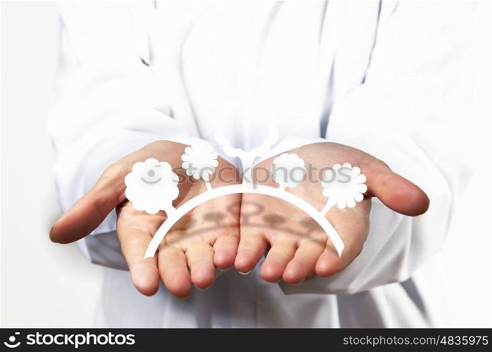 Protect nature. Close up of human hands with figures of nature
