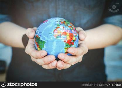 Protect our world in human hands. Human hands holding Green planet , Save earth concept.