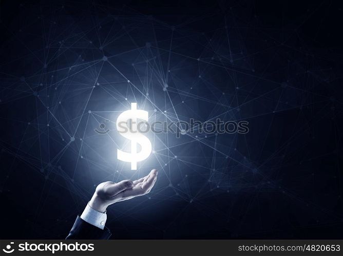 Protect your savings. Businessman hands on dark background holding glowing dollar sign