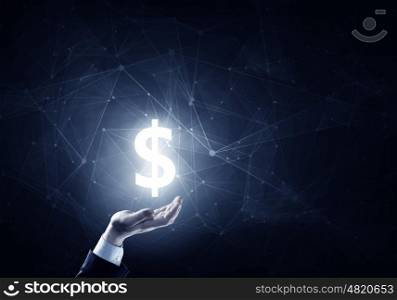 Protect your savings. Businessman hands on dark background holding glowing dollar sign
