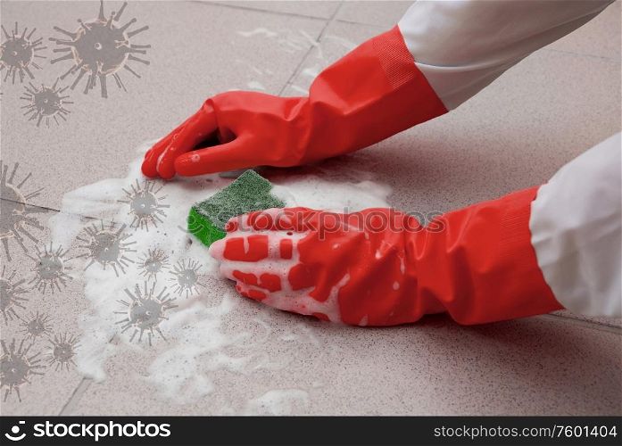 protecting hand from detergents, washing floor by cleaning sponge. housework