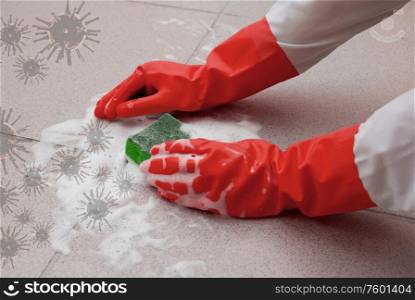 protecting hand from detergents, washing floor by cleaning sponge. housework