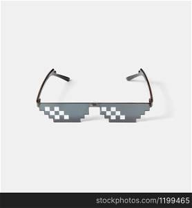 Protective art pixel glasses using for work with computers screens, phones and TV on a light grey background, copy space.. Art pixel glasses for protection from harmful rays.