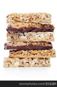 Protein cereal energy bars with nuts and caramel and chocolate for breakfast on white background