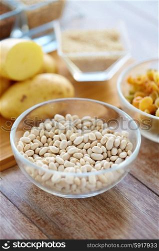 protein diet, cooking, culinary and food concept - close up of beans in glass bowl on table