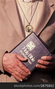 Protestant Minister holding Bible