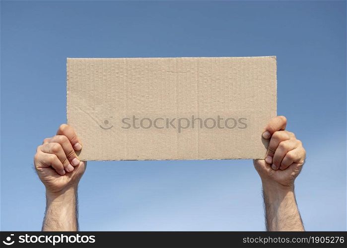protester holding board with mock up. Beautiful photo. protester holding board with mock up