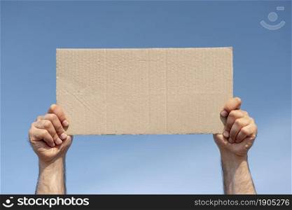 protester holding board with mock up. Beautiful photo. protester holding board with mock up