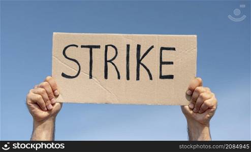 protester holding board with strike