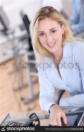 Protrait of office worker using electronic tablet