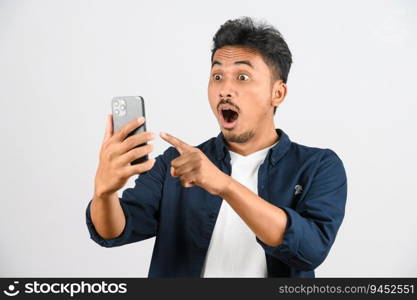 Protrait of Young asian man expressing surprise while using mobile phone isolated over white background. Technology concept.