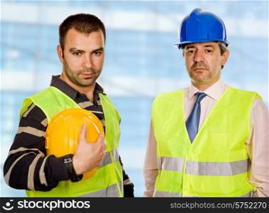 proud boss and worker standing looking at the camera