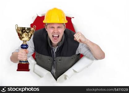 Proud builder holding trophy