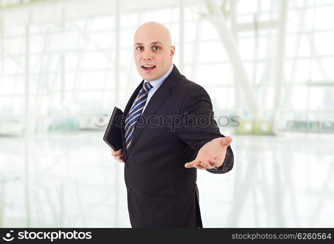 proud businessman with a tablet pc, at the office