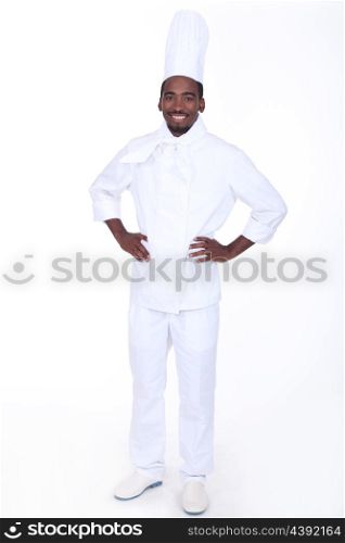 Proud chef stood with hands on hips