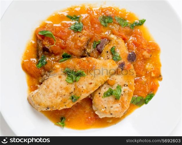 Provencal chicken breasts, a simple French classic of floured fried chicken and a tomato, garlic, anchovy, wine and herbs.