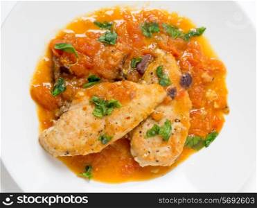 Provencal chicken breasts, a simple French classic of floured fried chicken and a tomato, garlic, anchovy, wine and herbs.