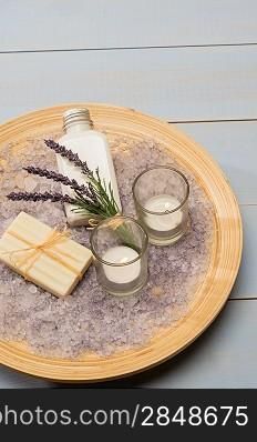 Provence style aromatherapy lavender cosmetic products on wooden tray
