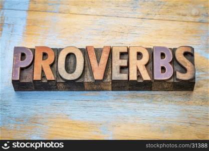 proverbs - word abstract in vintage letterpress wood type printing blocks against grunge wood