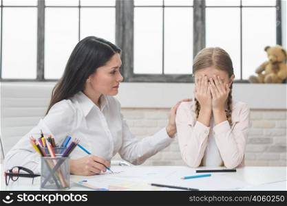 psychologist supporting girl suffering from depression