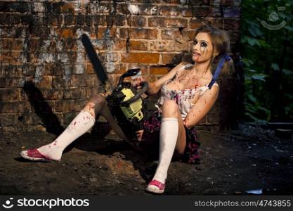 Psychotic woman with a chainsaw covered in blood