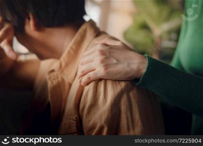 PTSD Mental Health, Encouraging Concept. Touching with Comfortable Hand to Helping a Depressed Person feel better. Hugging from behind