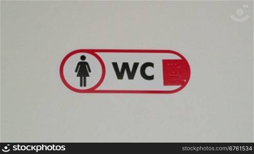 Public female toilet door sign