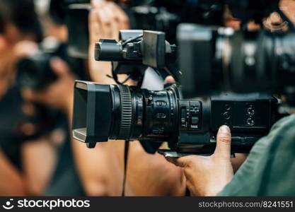 Public live event media coverage, television cameras at a press conference. Public Live Event Television Coverage